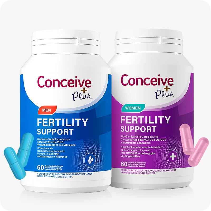 Conceive Plus Couples Bundle Fertility Support | His/Her Deal (FR) product image showing two white supplement bottles — one with a blue label for men's fertility support and other with a purple label for women's fertility support — positioned side by side with visible pink and blue capsules, highlighting gender-specific fertility support in French and Dutch bilingual packaging.