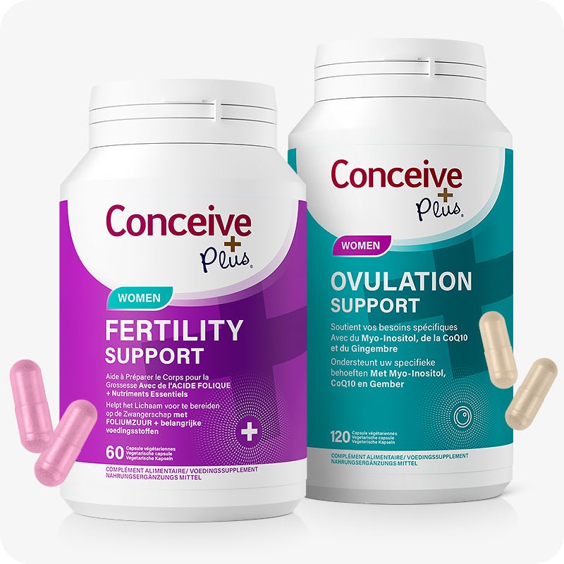 Conceive Plus Ovulation Pack - Fertility + Ovulation Support (FR) featuring two bottles: one in purple labeled "Women Fertility Support" and one in teal labeled "Women Ovulation Support", both with French and Dutch text, showing pink and beige capsules in front, presented on white background.